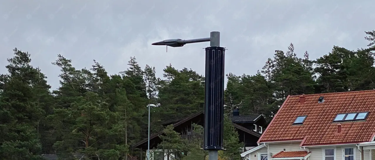 Vertical solar street light stands in a little football field_1