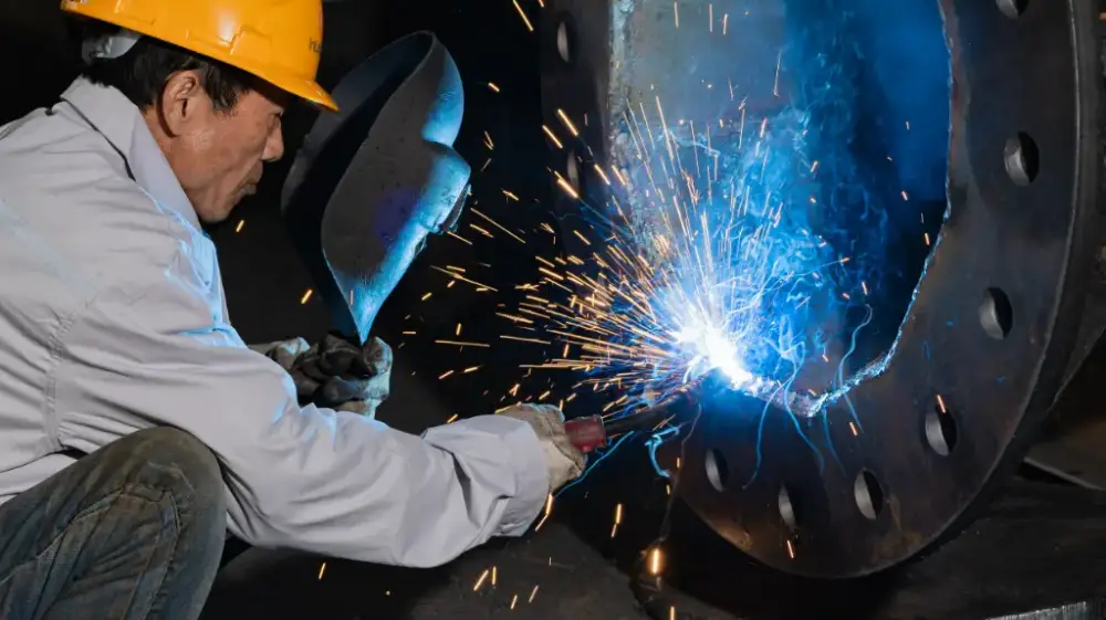 Close-up of the full welding process of the lamp pole flange