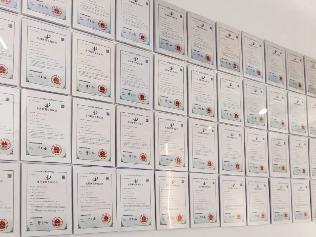 Certificate wall, clearly displaying various honorary certificates